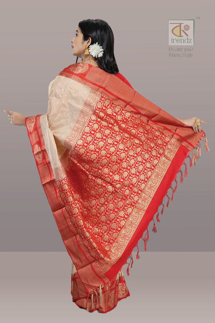 Off White Kanjivaram with Red base and Golden Zari weaving Pallu
