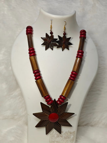 Striped bamboo star flower pendant with red centre on maroon bead and bamboo tube necklace with matching star earrings