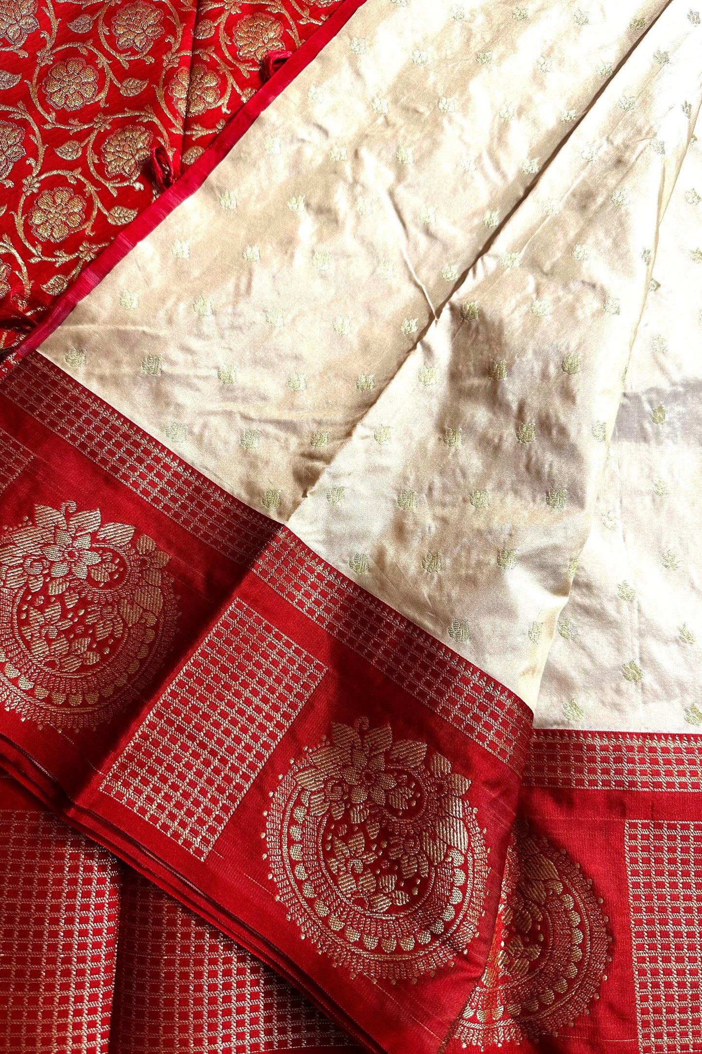 Off White Kanjivaram with Red base and Golden Zari weaving Pallu
