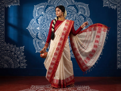 Santipur handloom cotton saree with red woven border pallu and gold zari, styled for Durga Puja