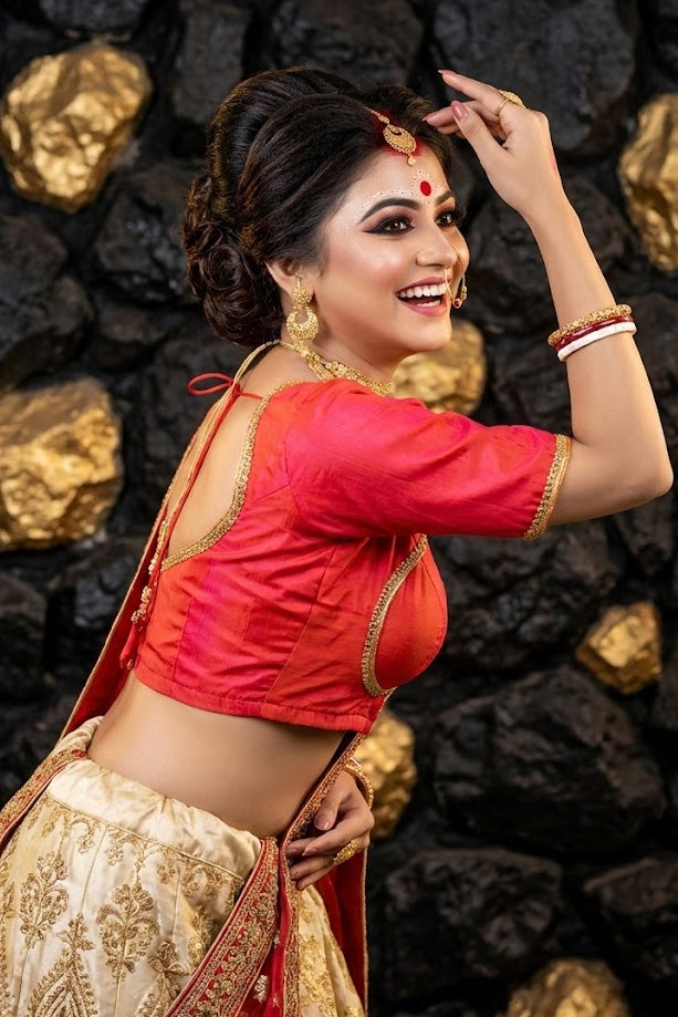 Model wearing vibrant pink Masaba print blouse with a contrasting saree for a festive look.