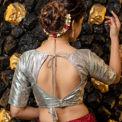 Texture shot of shimmering metallic cotton silk fabric in silver color.