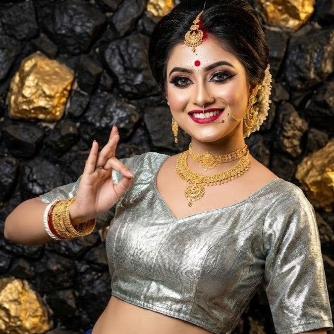 Texture shot of shimmering metallic cotton silk fabric in silver color.