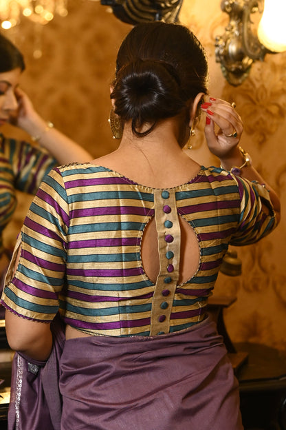 Circular back design of striped silk blouse featuring a stylish vertical button strip.