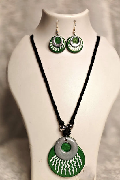 Alternate angle of layered terracotta sun disc medallion pendant in emerald green and silver - Bong Trendz