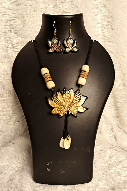 Alternate angle of hand-painted gold lotus terracotta pendant on black beaded necklace - Bong Trendz
