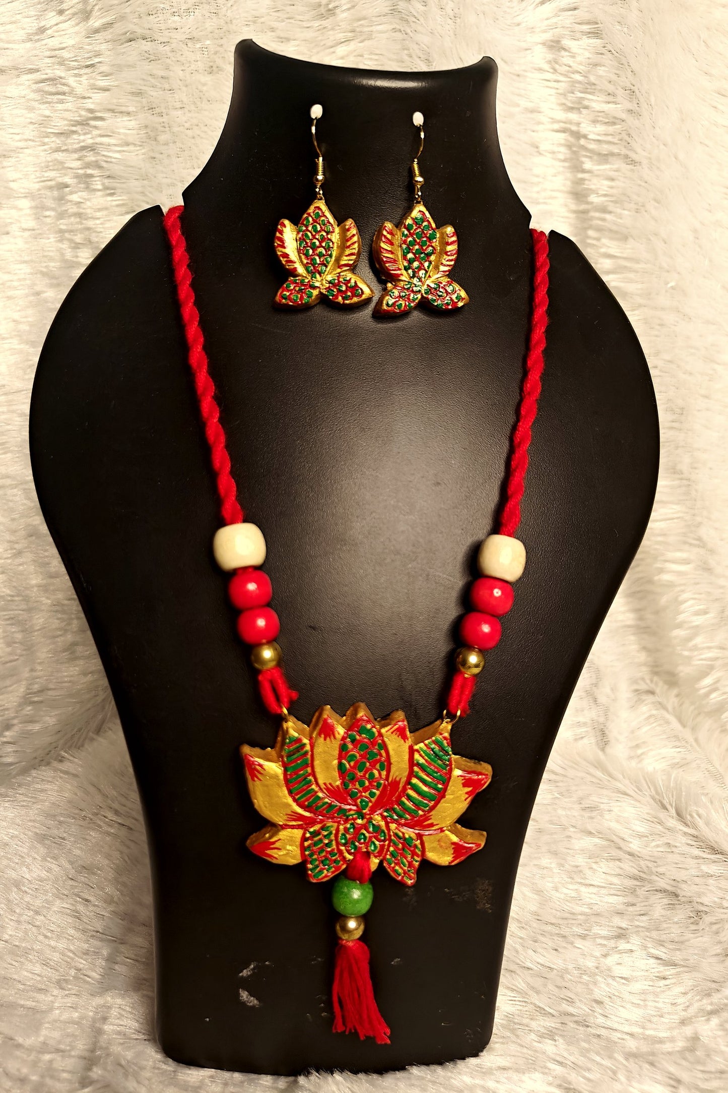 Alternate angle of hand-painted gold lotus terracotta pendant on red beaded necklace - Bong Trendz