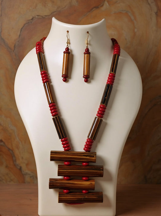 Tribal bamboo necklace with stacked bamboo tube ladder pendant, red wooden beads and matching bamboo tube earrings on a white bust