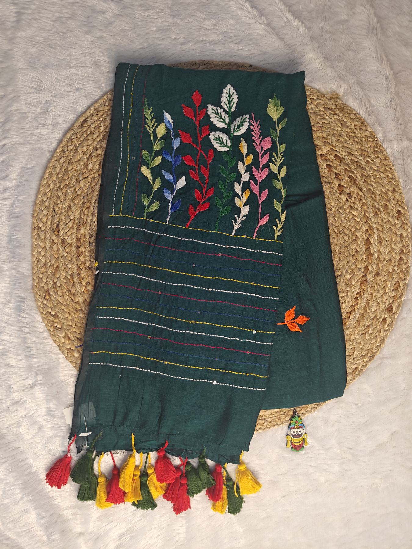 Bottle green Belpotra pure mul cotton saree flatlay with bullion stitch bael leaf embroidery and colourful tassels