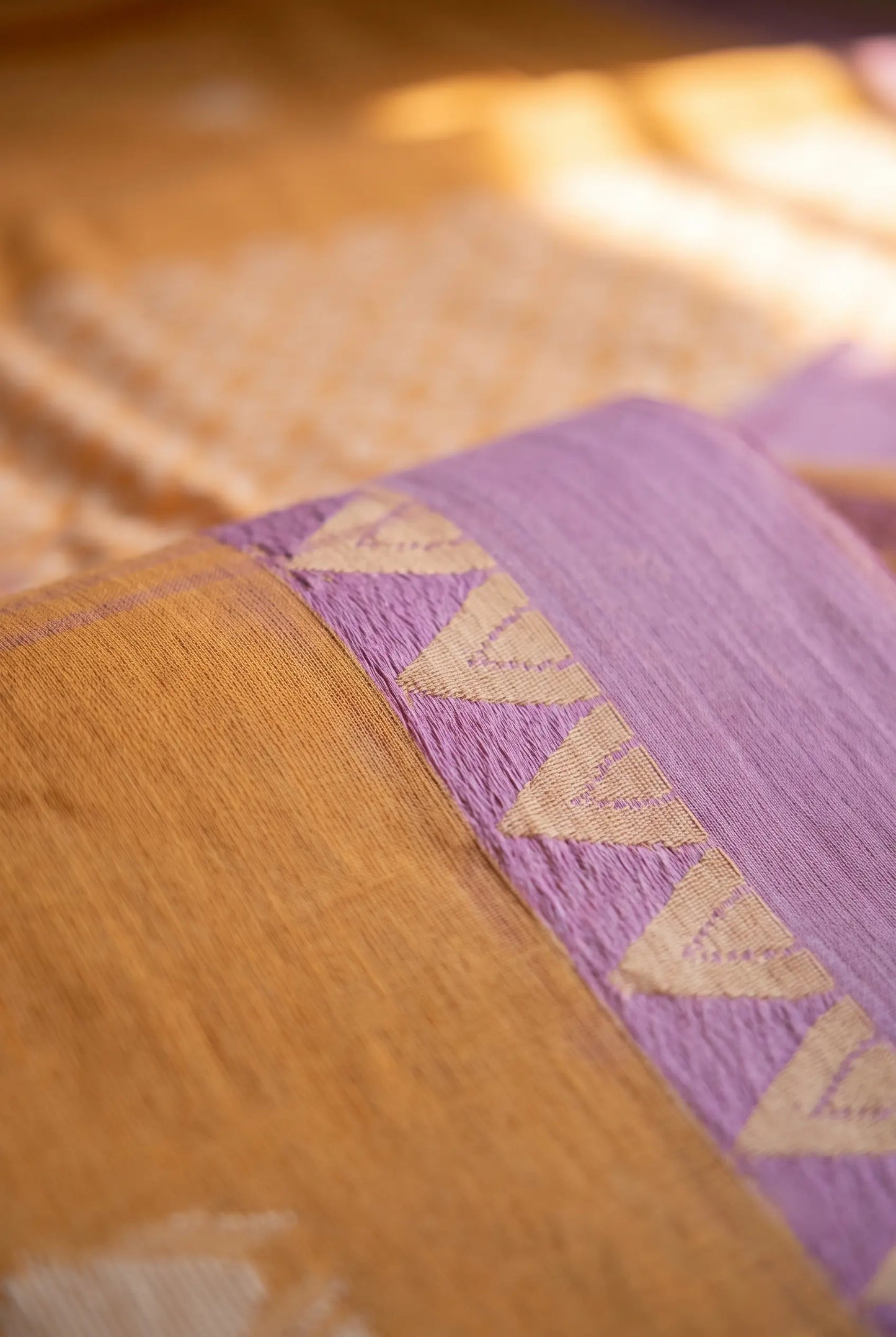 Side drape view of Sunlit Peach Jamdani handloom cotton saree with lavender border, featherlight fall