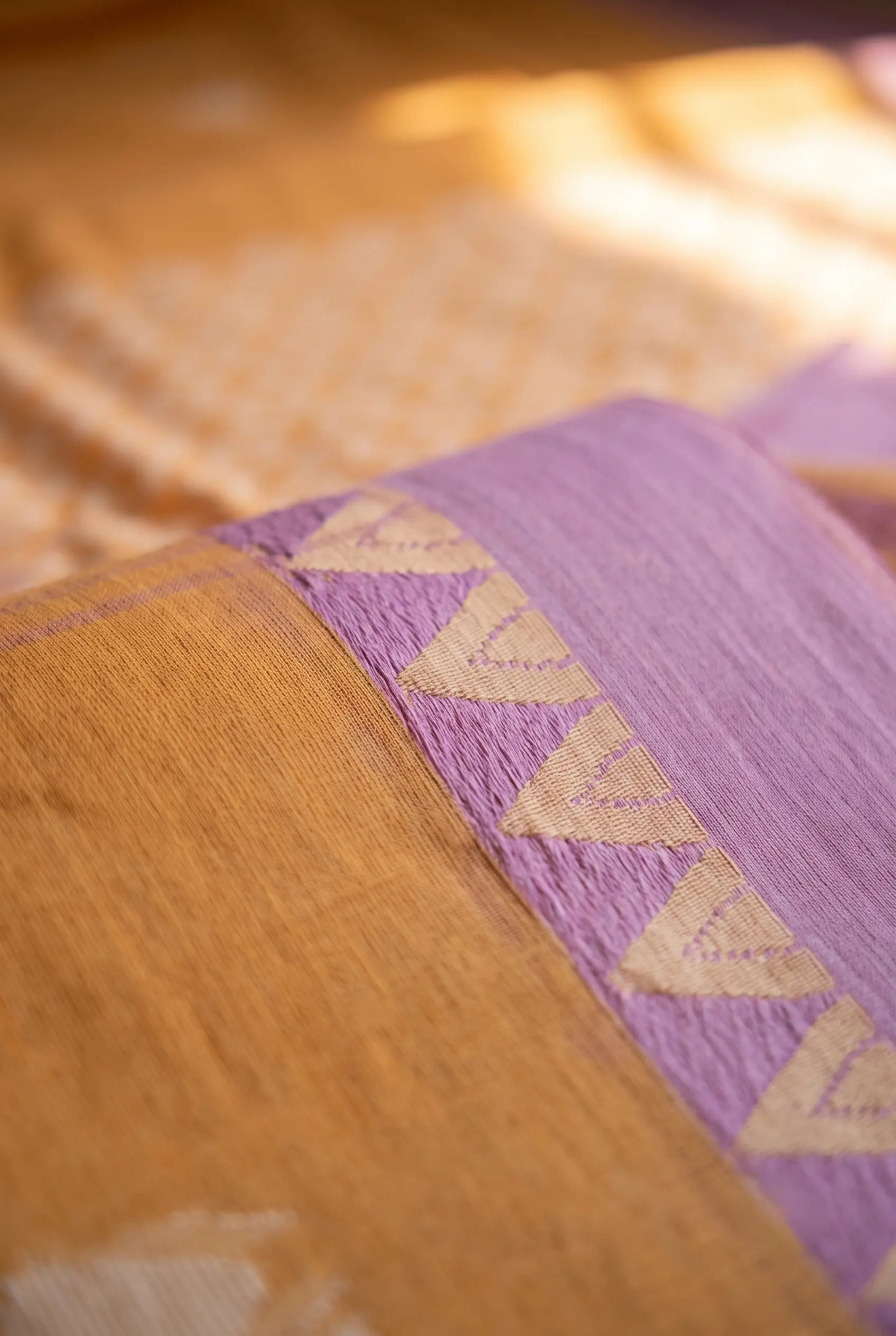 Side drape view of Sunlit Peach Jamdani handloom cotton saree with lavender border, featherlight fall