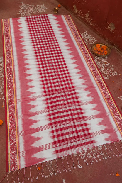 Shantipur GI tag Ikkat cotton saree draped, showing red and white check body with ikkat ombre border