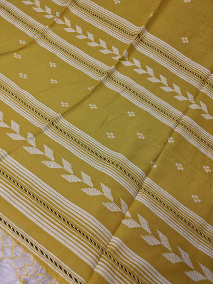 Close-up of the mustard Tirlata saree's arrow buti chevron border