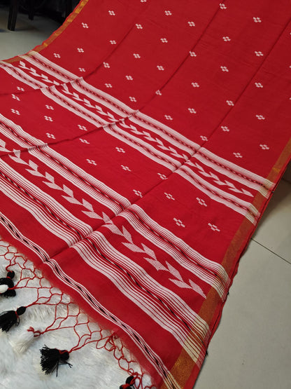 Close-up of the red Tirlata saree's arrow buti chevron border